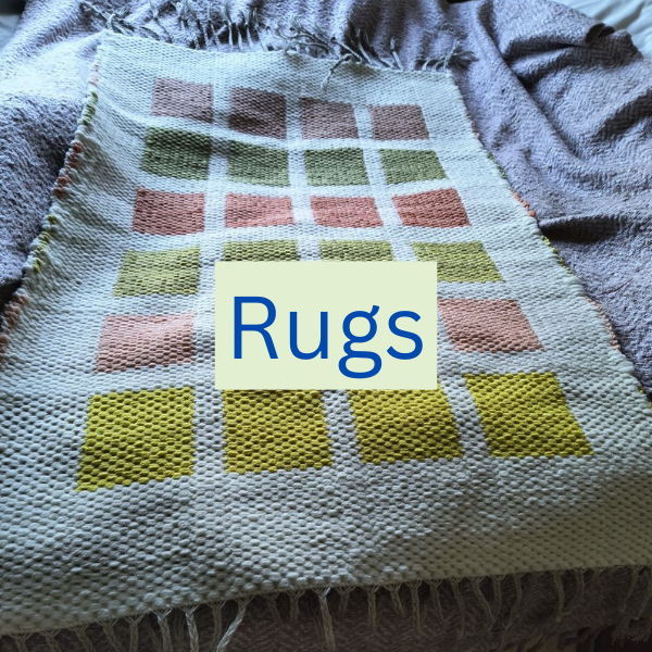 Multicoloured block rug with the word rugs onto the top