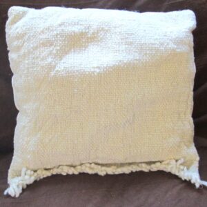 cream cushion on a brown background