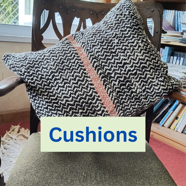 black and white cushions with pink stripe on a chair